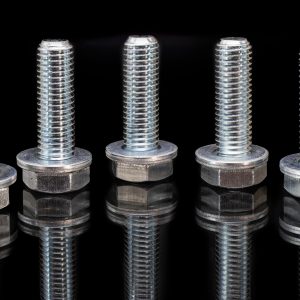 metal-bolts-with-reflection-on-a-black-background-close-up-industry-fasteners-copy-space